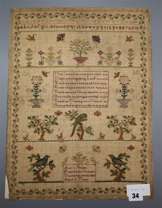 An 1827 sampler, unframed 43 x 33cm